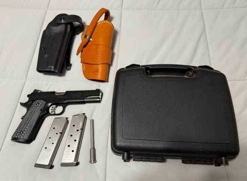 Like new Springfield TRP in 45 with holsters